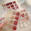 Accesorios para Uñas Mini Lazo de 12 Rejillas Tamaños Mixtos Color Café Rojo Lazo Flotante Rhinestones de Resina para Uñas Venta al por Mayor