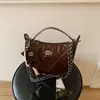 Bolso estilo Chanel de estrella y luna para mujer, nuevo modelo 2026, bolso de axila de nicho de lujo ligero, bolso de cadena acolchado, bolso de mano y bolso cruzado