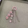 Colgante para Teléfono Estilo Ins de Flores Azules Frescas, Borla de Perlas Corazón de Cristal, Colgante de Bolso Femenino para Mujeres