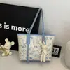 Bolso Tote para Mujer de Gran Capacidad Bolso de Hombro Sentido de Alta Gama Bolso Grande Transfronterizo Súper Caliente de Moda Nicho Graffiti Clase Bolso de Viaje