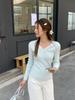 Camiseta de manga larga con cuello en V y lazo de encaje, suéter de punto básico para mujer, diseño de nicho de interior para primavera, otoño e invierno.