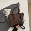 Bolso de mano tipo cubo nuevo de primavera 2026, transfronterizo, estilo vintage simple, de alta gama, moderno, para ir al trabajo, bolso de hombro cruzado de moda