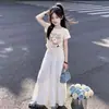 Conjunto de Dos Piezas Estilo Universitario 2026, Nueva Moda de Verano, Camiseta de Manga Corta Personalizada de Dibujos Animados, Falda Dulce con Lazo