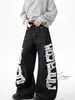 Pantalones Negros Transfronterizos con Estampado de Letras Estilo Americano, Costuras Visibles, Parches Desconstruidos, Corte Holgado, Pantalones Largos Únicos Estilo Urbano