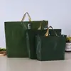 Bolsas de embalaje para ropa al por mayor, bolsas de mano de plástico de color liso, bolsas de compras para regalos de Año Nuevo, logo personalizado