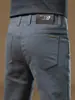 Pantalones gruesos de negocios casual de alta gama de Hong Kong para otoño/invierno 2026 para hombre, cómodos, corte recto ajustado, versátiles, con forro polar