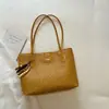 Bolso de mujer de gran capacidad, elegante, nuevo modelo de verano 2026, bandolera popular y exquisita de color liso, bolso tote para el trabajo