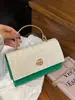 2026 Verão Novo Estilo Capa Tecida Estilosa Simples Moda Corrente de Menina Bolsa Transversal de Ombro para Mulheres
