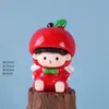 Navidad de fábrica paz fruta linda figura adorno de resina tablero de coche decoración regalo adorno pequeño venta al por mayor