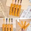 Uma coleção de marcadores de página de bambu acessíveis, apresentando designs estilo chinês e ideias criativas para marcar páginas durante a leitura.. Papelaria para estudantes no atacado