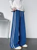 Pantalones de chándal a rayas con estampado de escamas de dragón para hombre, estilo americano de alta calle para otoño, pantalones casuales de pierna ancha, pantalones deportivos rectos holgados y fluidos de moda