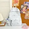 Mochila de Estudiante de Primaria para Niñas con Lunares Blanco Leche y Rosa Palo con Lazo, Adecuada para la Clase y el Transporte Diario, Mochila Versátil de Doble Hombro