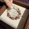 Pulsera RedwoodNatural Flor de Resina Roja Oro Negro Super Siete con Sándalo Dorado y Cristal de Limón, Única y Versátil