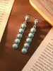 Pendientes de estilo bohemio étnico con explosiones transfronterizas europeas y americanas, con diamantes y turquesas, pendientes huecos, pendientes retro para mujer que combinan con todo.