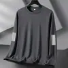 Camiseta de manga larga para hombre, capa interior de otoño para hombre, camiseta base elástica de corte holgado, camiseta estampada estilo coreano ins para hombre