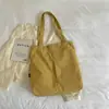 Bolso de mano casual simple para mujer, gran capacidad, bolso de hombro versátil, bolso de trabajo, mochila escolar para estudiantes, nuevo bolso de mano 2026