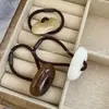 Cuerda para el pelo práctica de botón combinable Anillo para el pelo de resina color toffee Cuerda para el pelo Goma para coleta alta Bola de tendón Cubre pelo Accesorios para el pelo para mujer