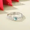 Anillo de cobre y jade tipo moneda para mujer, con un diseño único y elegante, un toque de lujo y un nuevo anillo de jade estilo chino, perfecto como regalo, disponible para venta al por mayor
