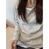 Nueva camiseta de manga larga de estilo americano a rayas, imitación de dos piezas, versión coreana para mujer, base holgada para primavera y otoño, top de moda