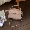 Bolso de Mano de Lujo Ligero Estilo Coreano para Mujer 2026 Primavera Nueva Moda Bolso de Hombro para el Trabajo Bolso Cruzado Elegante de Color Sólido para Mujer
