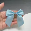 En stock Venta al por mayor Accesorios de moño Cinta de poliéster DIY Hecho a mano Multicolor Diadema de moño Accesorios de cinta para prendas