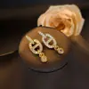 Pendientes colgantes ovalados de cobre y circonio de lujo ligero de alta gama para mujer, moda retro, temperamento, para el trabajo, versátiles, joyería al por mayor