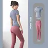 Conjunto de Ropa de Yoga sin Costuras Europea y Americana para Mujer, Camiseta Deportiva de Manga Corta para Fitness, Pantalones de Tiro Alto tipo Durazno para Levantar Glúteos, Conjunto Deportivo para Gimnasio y Running