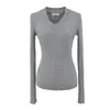 Suéter de Punto Trendy de Cuello V de Manga Larga para Mujer Estilo Europeo y Americano 2025 Diseño de Nicho Puño con Hendidura Camiseta Básica Superior
