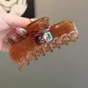 Pinza para el cabello redonda con diseño minimalista de nicho, con diamantes brillantes, pinza de garra para asegurar recogidos en la parte posterior de la cabeza, accesorio para cabello semi-recogido