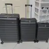 Yijiu Kai Baigou Maleta de Viaje de Aleación de PC de Bajo Precio con Apertura Frontal Equipaje Juego de Tres Piezas de Equipaje Barato
