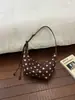 Bolso de Axila de Lunares Fresco y Dulce para Mujer 2026 Principios de Otoño Elegante Bolso de Albóndiga Plegado de Nicho Bolso de Hombro Único Versátil para el Trabajo