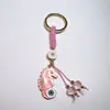 Colgante de Serie Ojo de Diablo Transfronterizo Europeo y Americano Colgante de Llavero de Joyería de Animales Ojo de Hueso con Goteo de Aceite Accesorios de Aleación para Mujeres