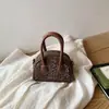 Mini Bolso de Bowling Estampado de Leopardo Transfronterizo Gama Alta Nicho Lujo Ligero Cartera de Monedas de Gama Alta Accesorios Bolso Cruzado Versátil para Niños