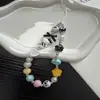 Cordão de celular de miçangas de nicho ins gato de desenho animado botão de estrela corda curta charm de câmera ccd portátil