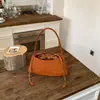 Bolso de mujer transfronterizo 2026 modelo nuevo de verano, bolso de hombro con patrón tejido simple y elegante, bolso de axila de alta calidad de moda