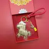 Shuibei Popular Oro Oro Puro 999 Hazte Rico Inmediatamente Llavero Colgante para Bolso Dibujos Animados Colgante de Regalo Venta al por Mayor