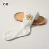 Medias para niñas estilo primavera y otoño, versátiles para usar con ropa exterior, con accesorios de girasol, leggings para niños, mallas para bebé con pies
