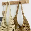 Bolso de paja tejida hecho a mano con diseño calado de gran capacidad para mujer, nuevo bolso de paja de estilo francés simple para vacaciones en la playa y uso en la playa