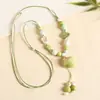 Collar con colgante de campana de mariposa de cerámica de estilo étnico retro para mujer, diseño nuevo y moderno, cadena larga para suéter, accesorios