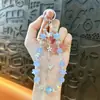 Estilo de lujo ligero borla mariposa con cuentas cadena para teléfono móvil llavero moda exquisito colgante para bolso accesorios para funda de teléfono móvil venta al por mayor