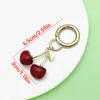 Artículo Popular de Comercio Exterior de Amazon: Llavero de Resina de Color Sólido con Goteo de Aceite Perla Cereza Accesorio de Llavero de Metal Colgante Pequeño