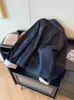 Chaqueta de mezclilla con solapas de puntada de contraste estilo retro japonés para mujer, nueva chaqueta casual ajustada estilo perezoso para primavera y otoño 2026