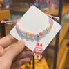 Corda de Mão Desenho Animado Fofo Infantil Atacado Pulseira de Estudante Tecido Lala Livro Vermelho Pequeno com Venda Quente em Pontos Turísticos