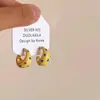 Pendientes Pequeños de Gota Amarilla de Leche Fresca con Puntos de Ola 2025 Nuevos Pendientes Explosivos para Mujer Lujo Ligero Retro Pendientes de Gama Alta