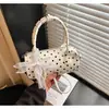 2026 Nuevo Bolso de Mano de Verano Coreano Bolso Tote Pequeño para Mujer Casual de Lunares Nicho Bolso Almohada Bolso de Hombro Cruzado Individual