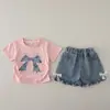Conjunto de outfit de verano para niñas, dulce y lindo, con una camiseta de lazo grande, un conjunto de dos piezas, nueva ropa de verano para niños 2026, venta al por mayor