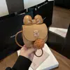 Otoño e Invierno Nuevo Bolso de Monedas para Bebé Oso Lindo Lazo Moda Versátil Lana de Cordero Bolso Cruzado para Niños