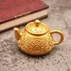 Suministro directo de fábrica de tetera de aleación con mantra de seis caracteres y tapa giratoria, una pieza decorativa de la suerte y auspiciosa para el hogar o el escritorio