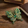 Broche de mariposa retro con incrustaciones de diamantes creativo, moderno, simple, con insectos huecos, para abrigo de mujer, ramillete, bolso, hebilla, accesorios