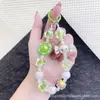 Bolsa de Moda Romántica de Gatito de Caramelo Colorido Llavero Colgante Super Hada Cristal Lanyard para Teléfono Colgante de Perlas